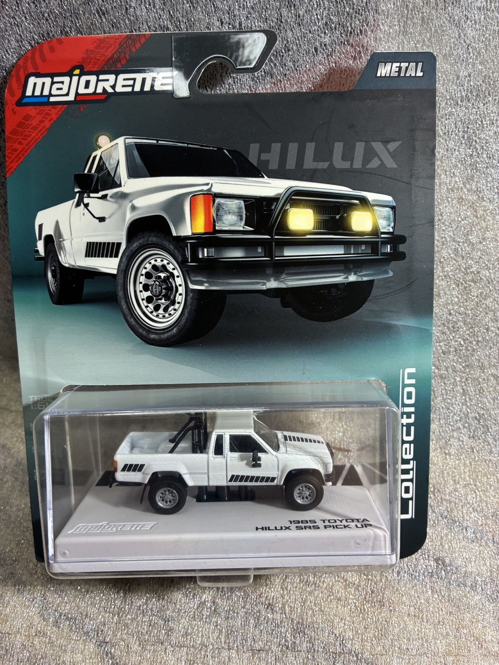 White 1985 Toyota Hilux SR5 Pickup Die-Cast Toy